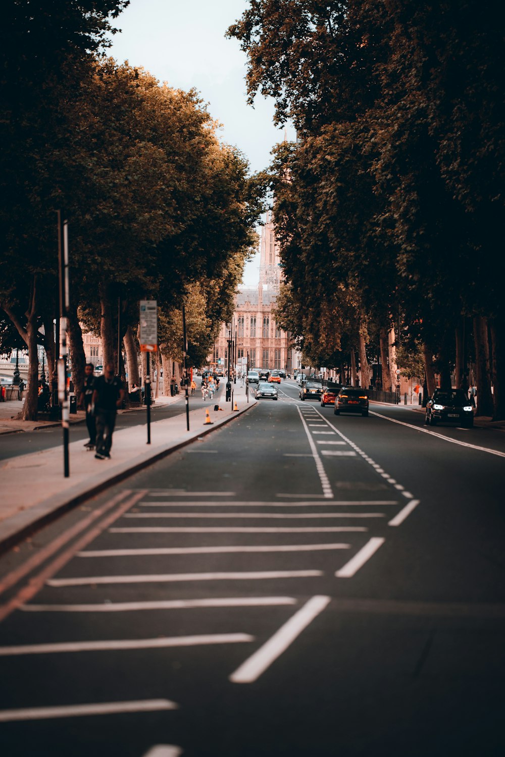 a city street with a few cars parked on the side of it