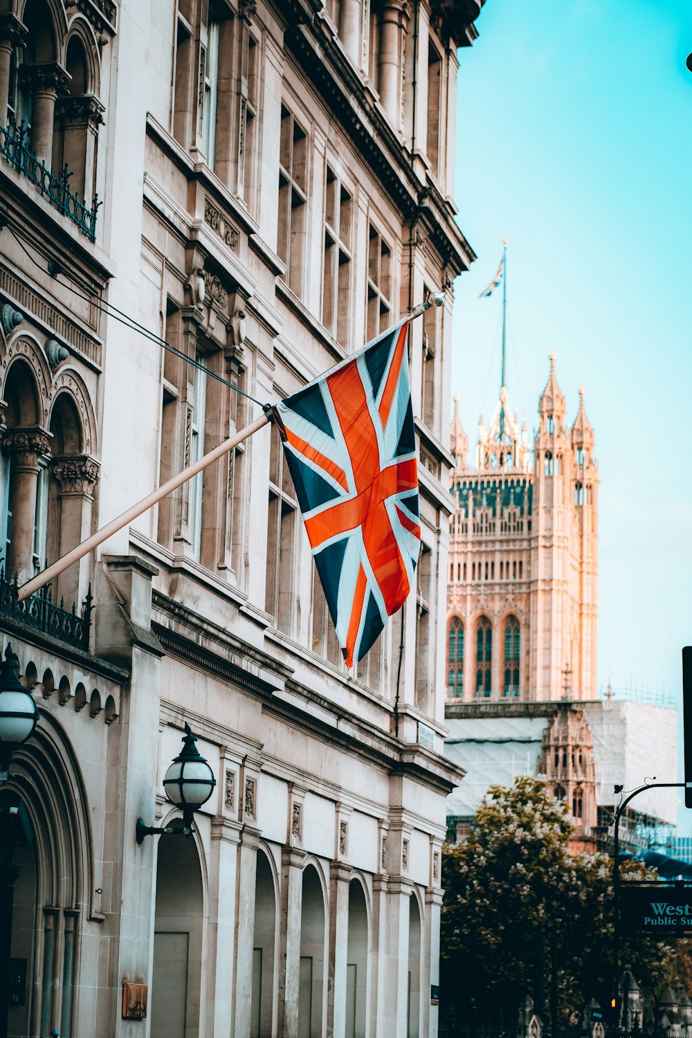 a union jack flag hanging from a building