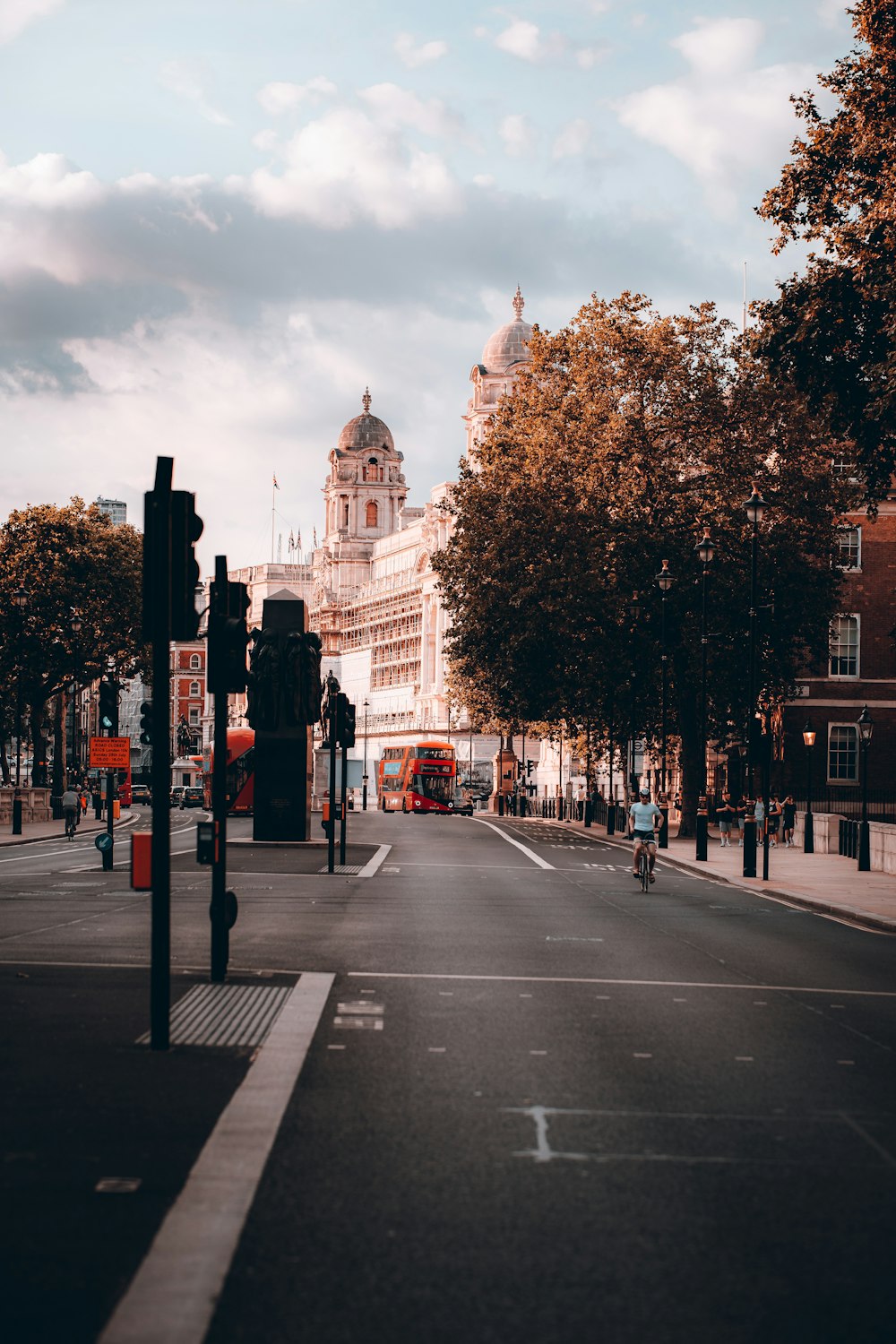 a city street with a bus on the road