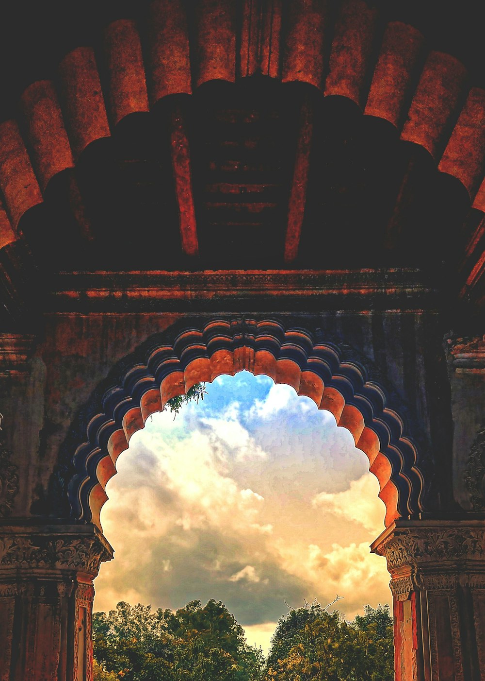 a view of the sky through an arch in a building