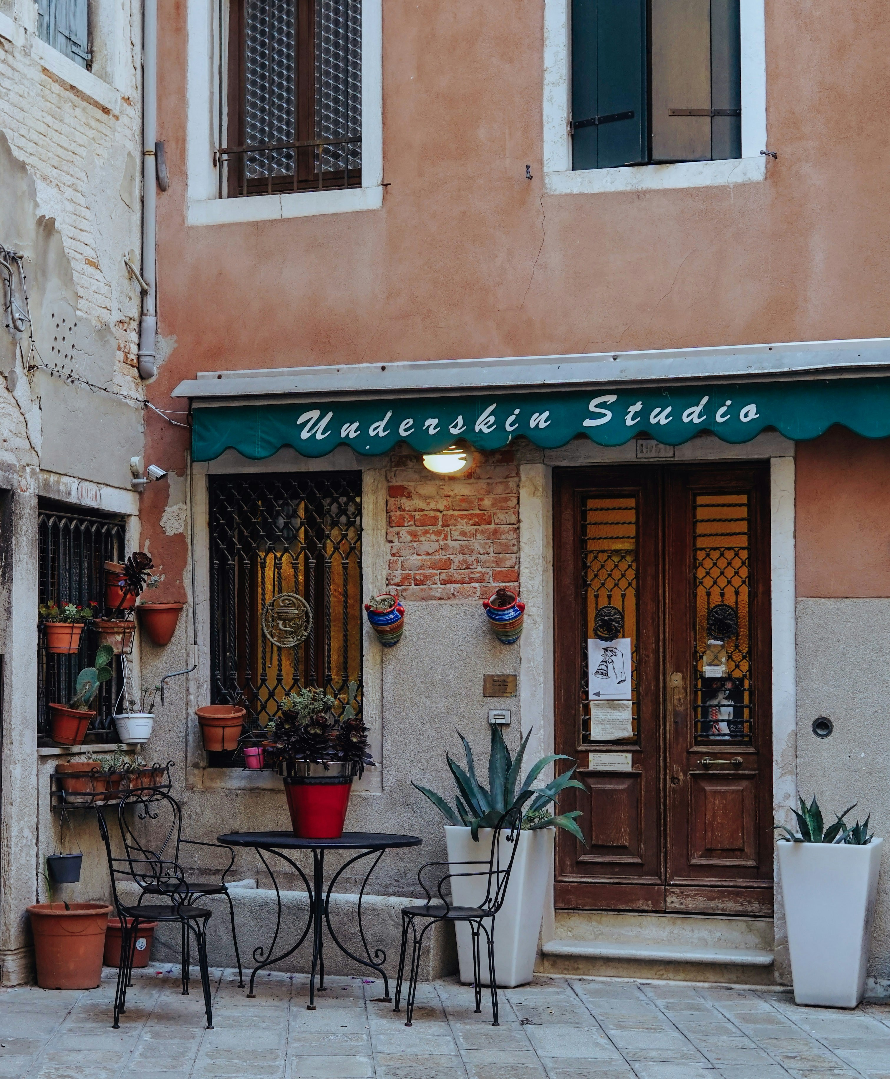 a building with tables and chairs outside of it