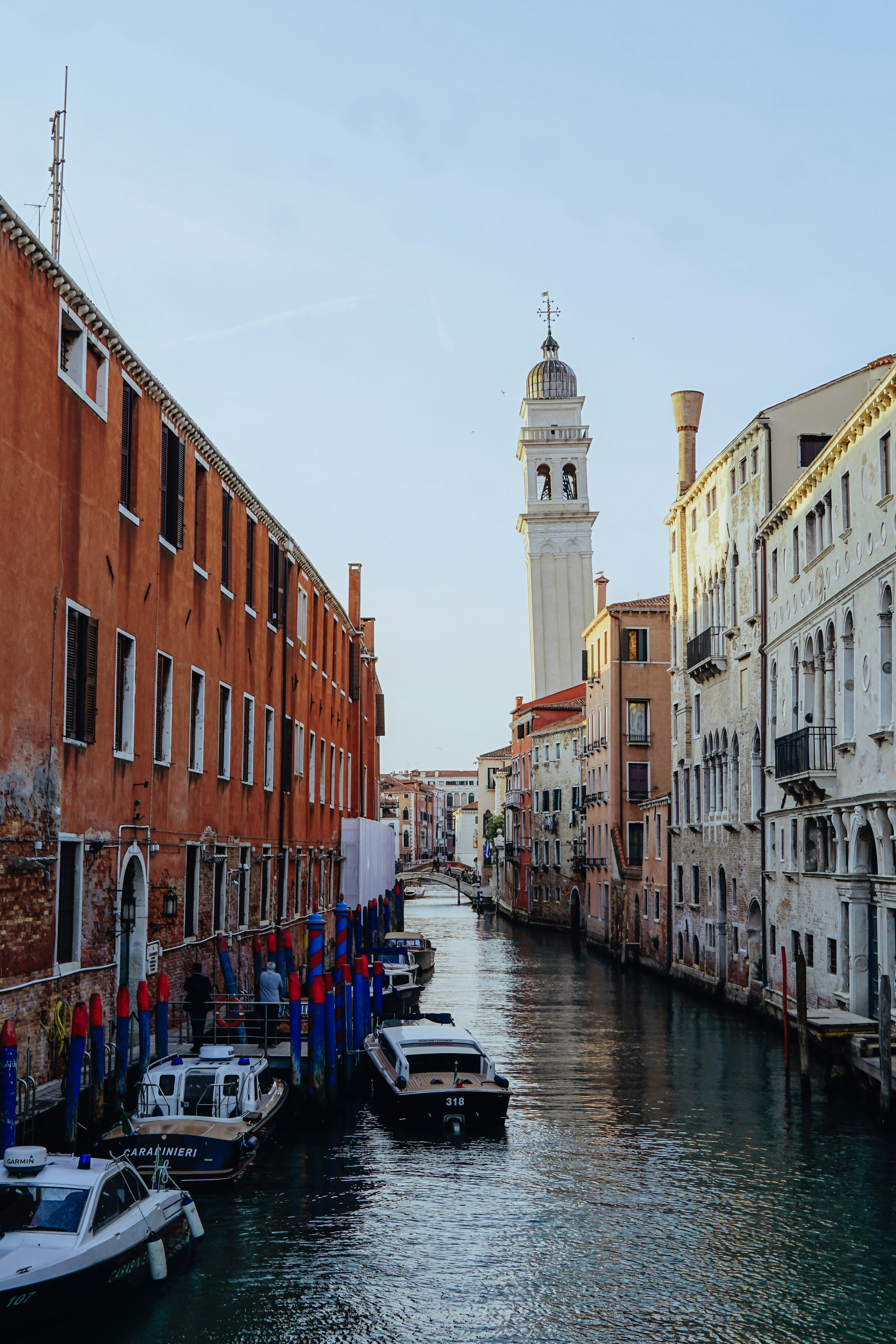 a waterway with boats and buildings on both sides