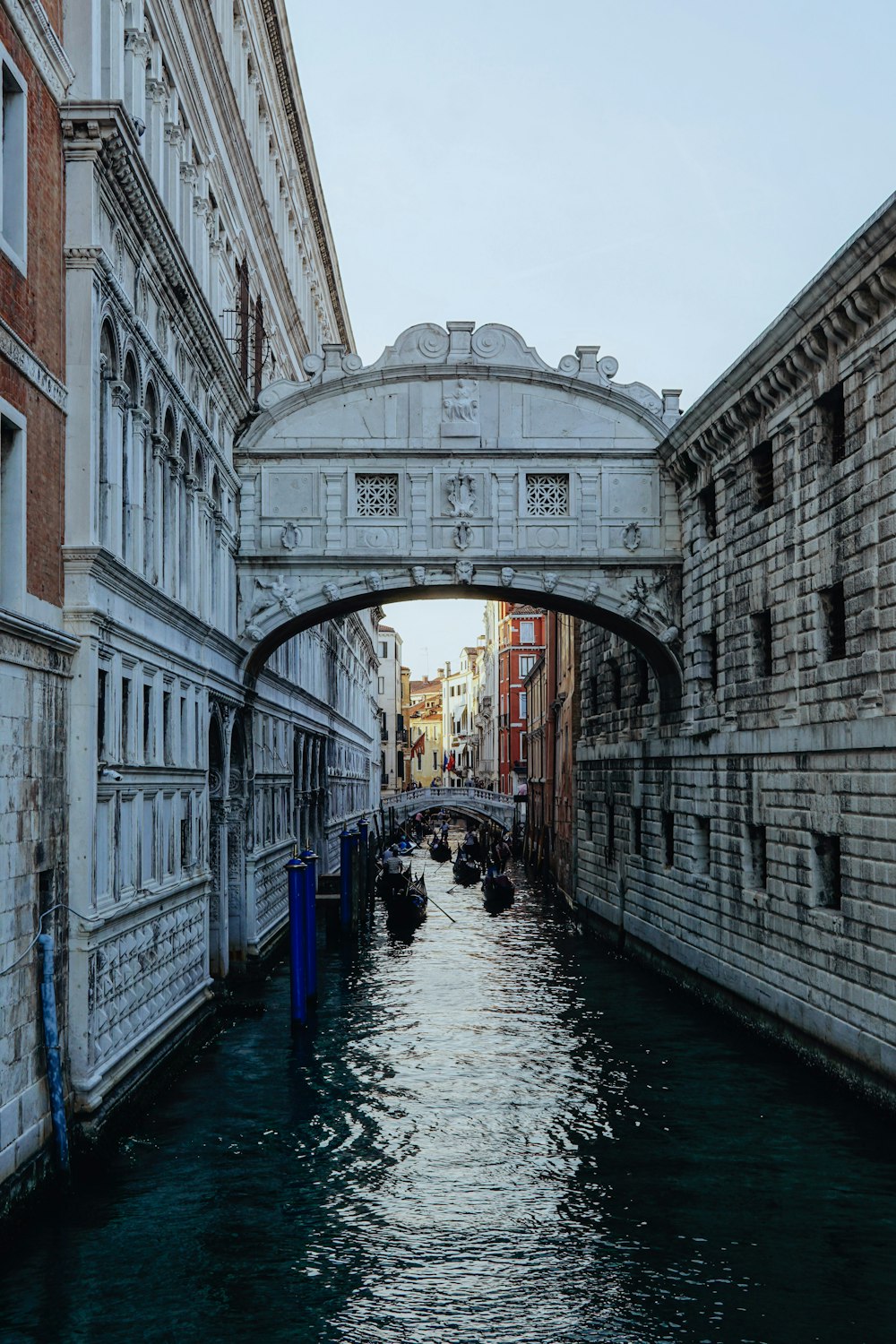 a bridge over a canal in a city