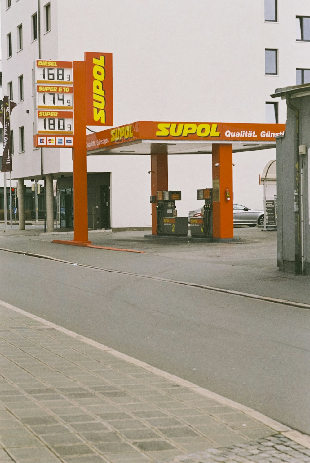 a gas station on the side of the road