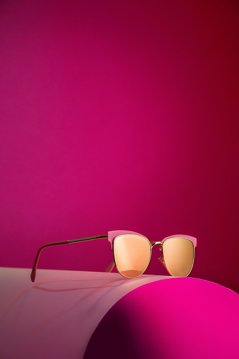 a pair of sunglasses sitting on top of a table