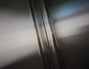 Close-up of a glossy metallic epoxy floor reflecting soft lighting.