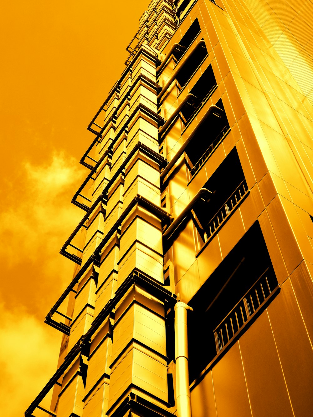 a very tall building with a sky in the background