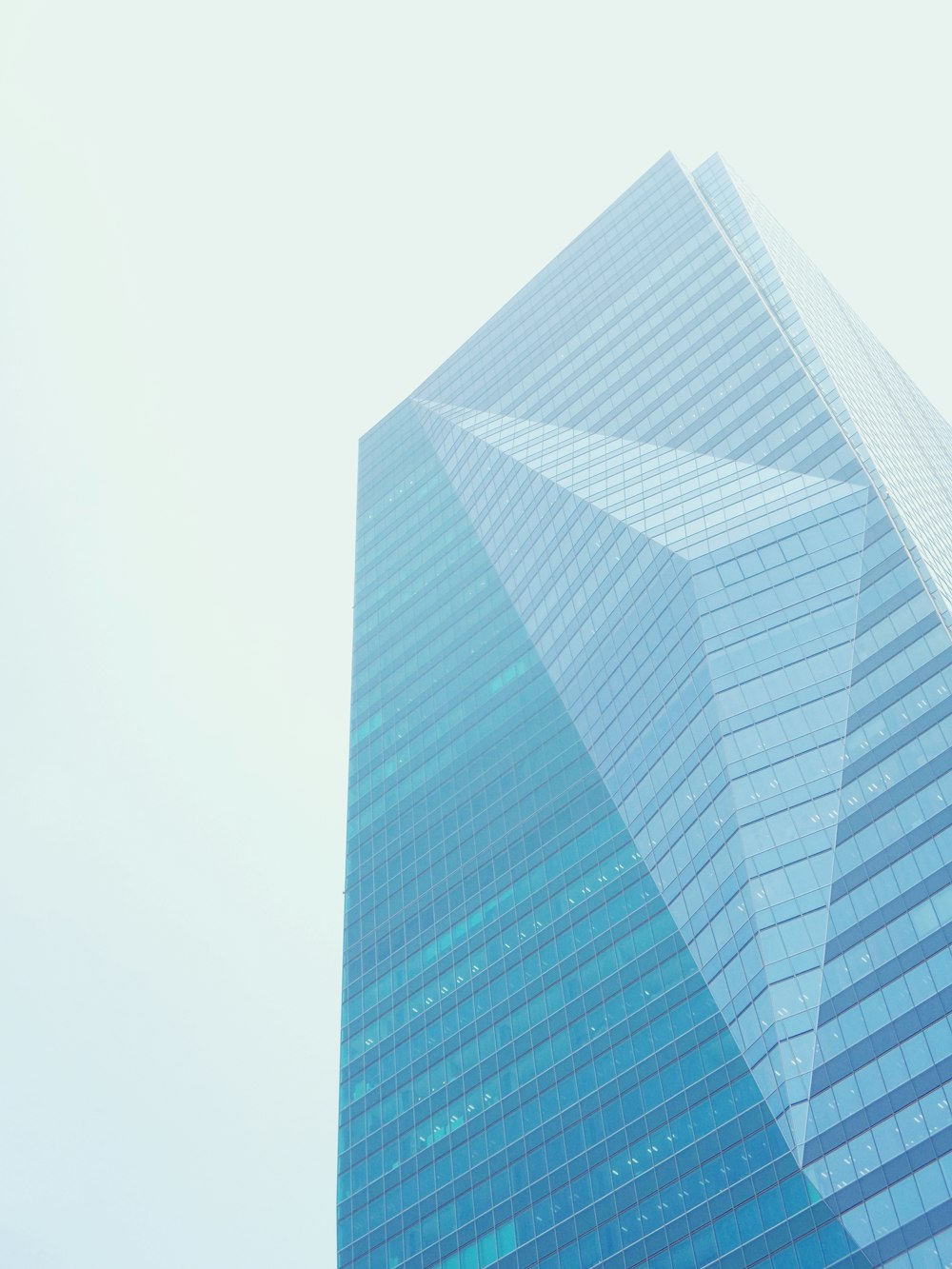 a very tall building with a sky background