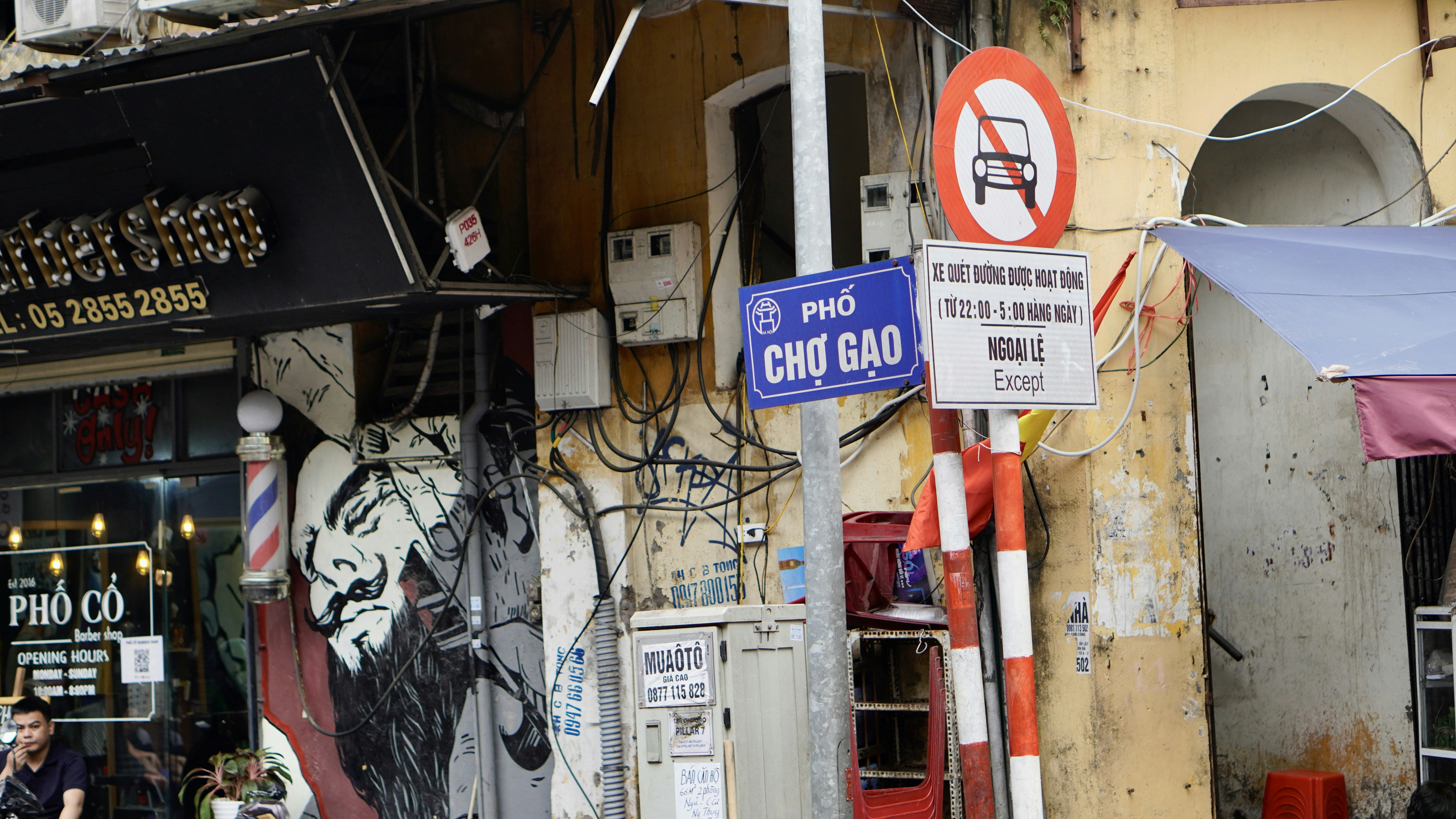 a couple of street signs on the side of a building