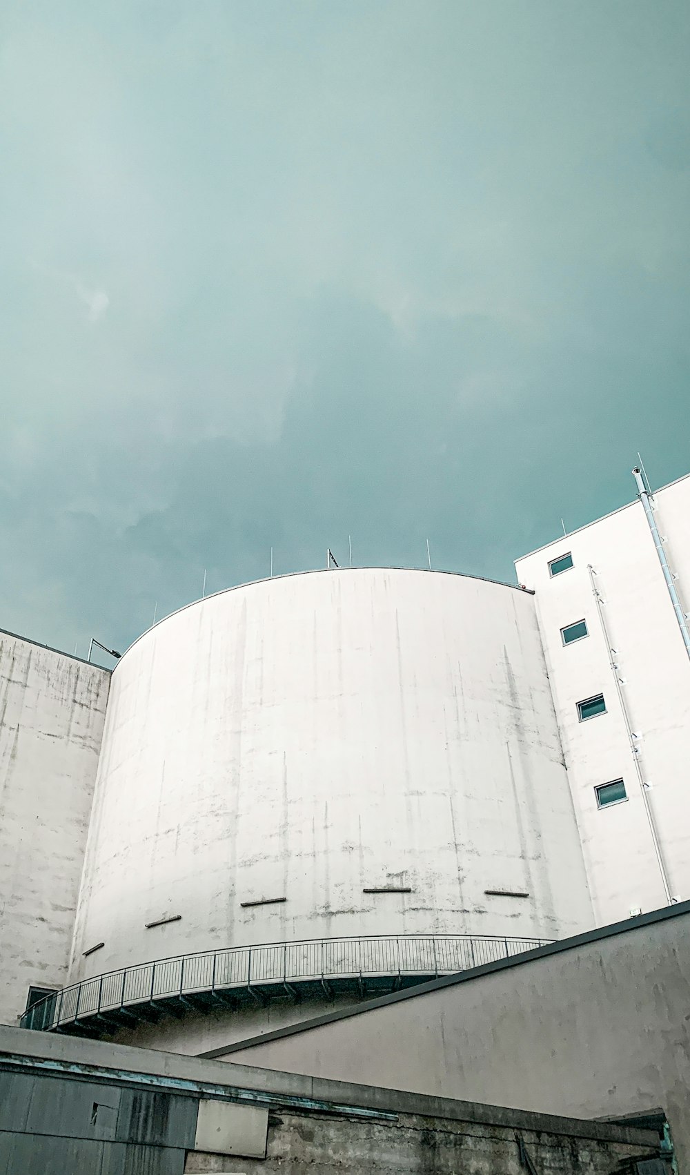 a large white building with a clock on it's side