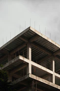 a building under construction with scaffolding on top