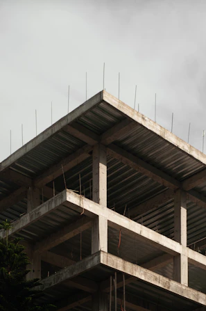 a building under construction with scaffolding on top
