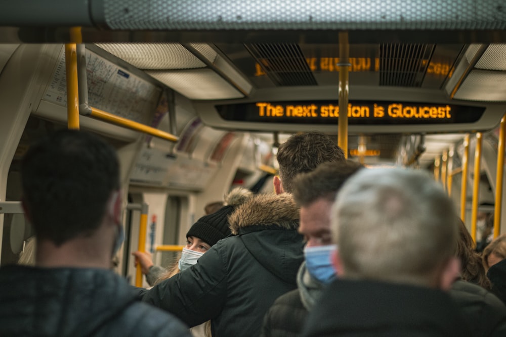 a group of people looking at a train station