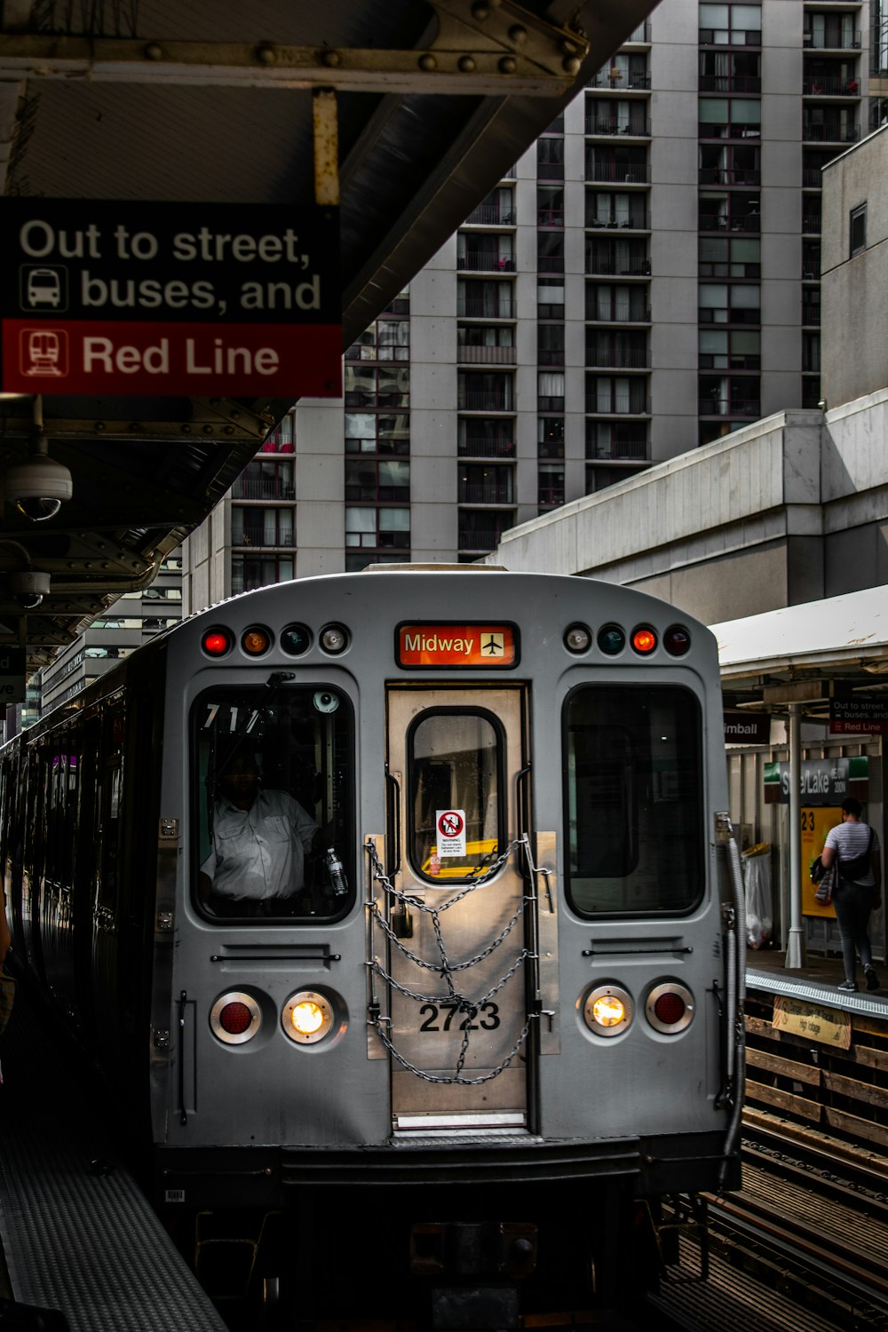 a train is parked on the side of a building