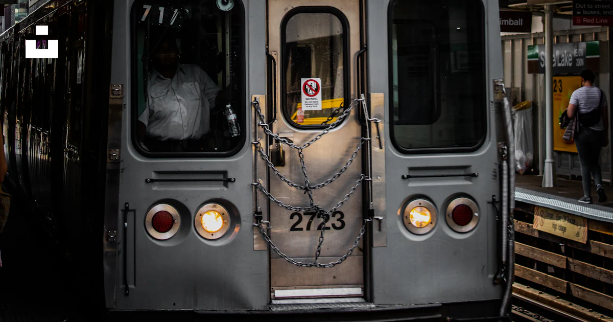 12913 Train A train is parked on the side of a building photo – Free The loop Image ...