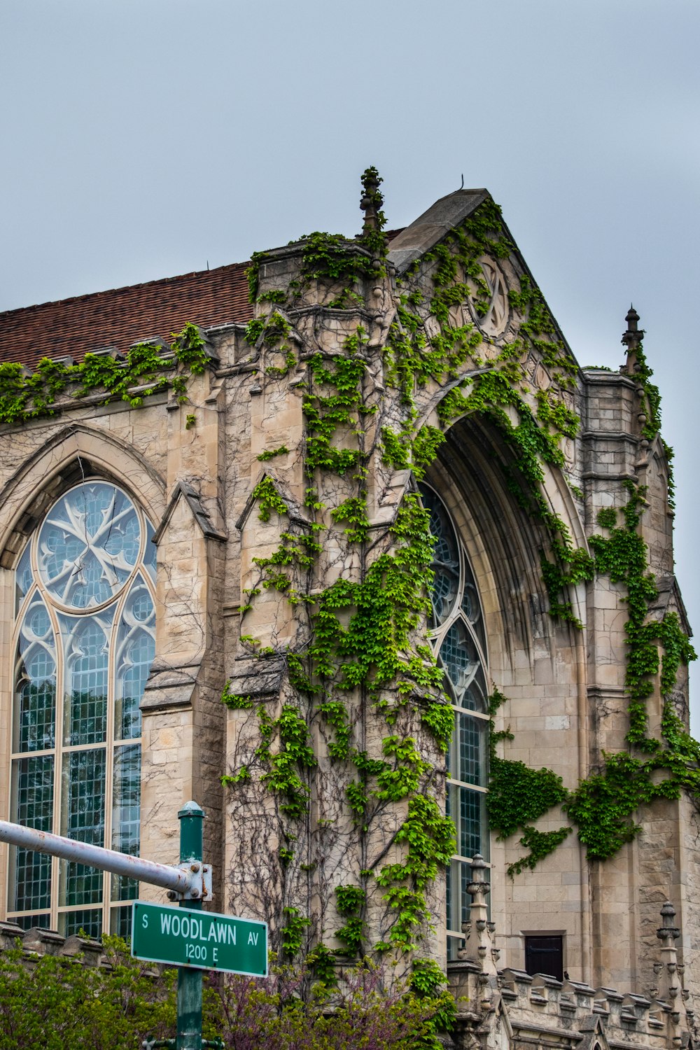 a large building with ivy growing on the side of it
