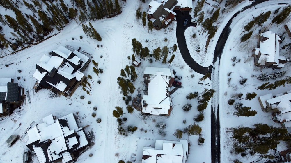 an aerial view of a snow covered village