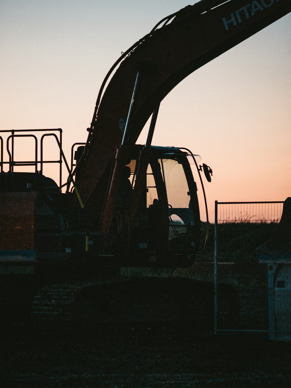 a large construction vehicle sitting in the middle of a field