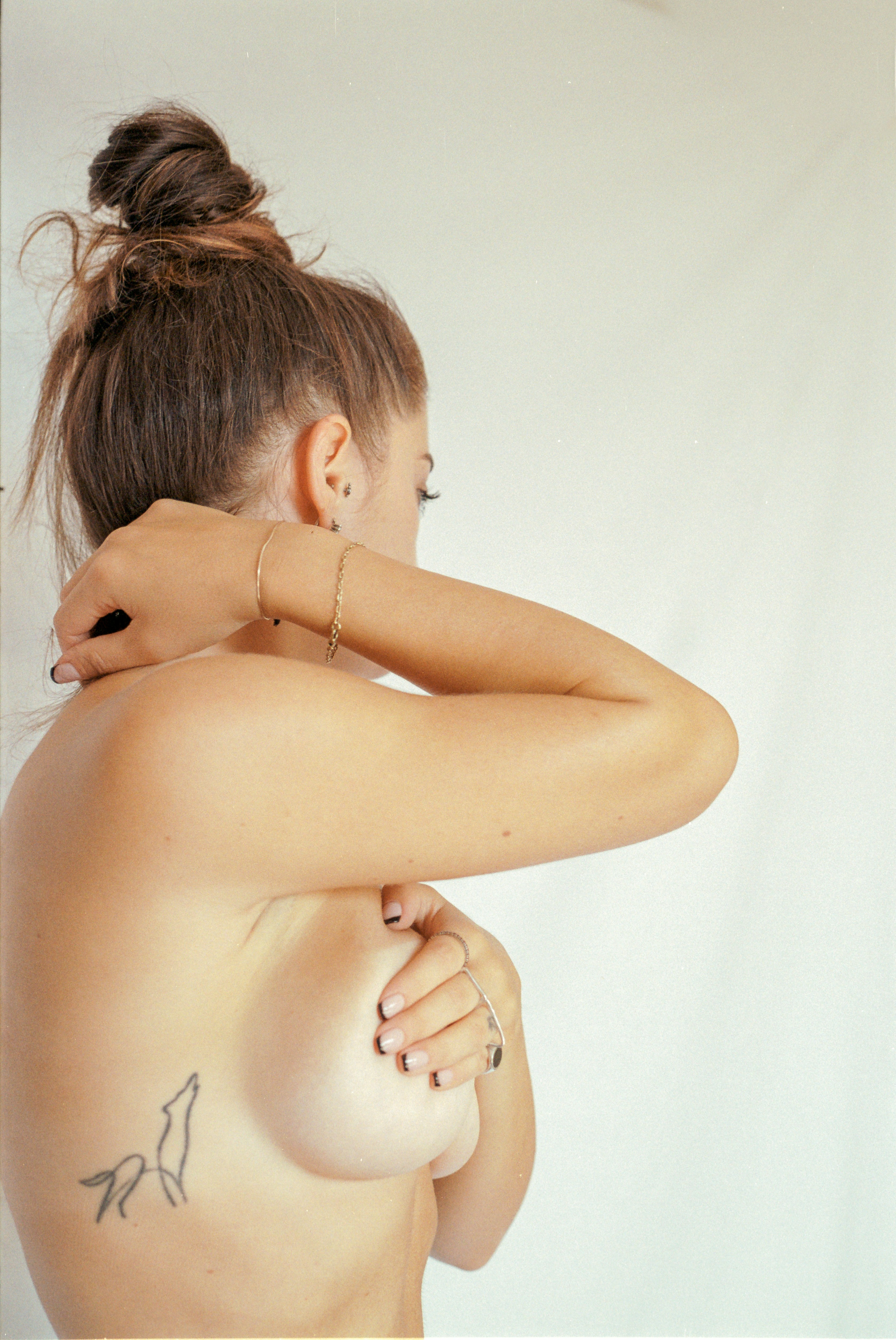 a woman with a tattoo on her back