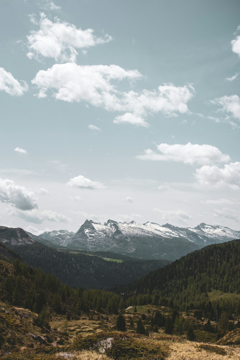 a view of a mountain range with snow on the top