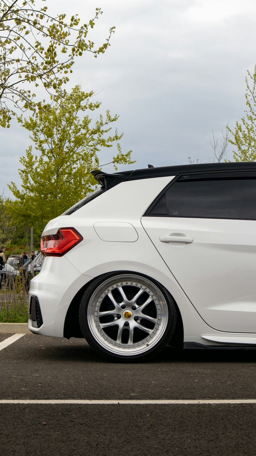 a white car parked in a parking lot