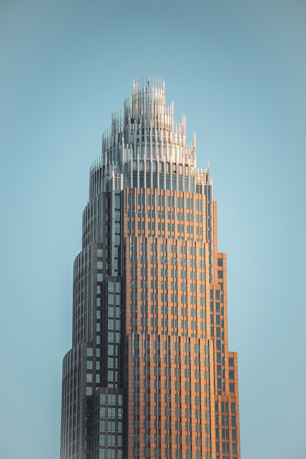 a very tall building with a sky background