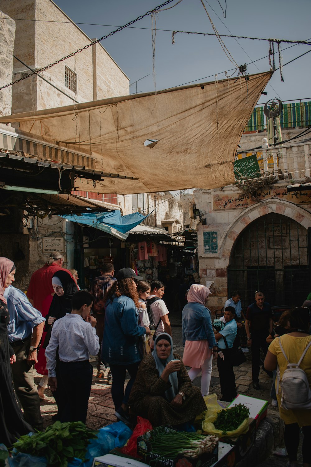 a group of people standing around a market