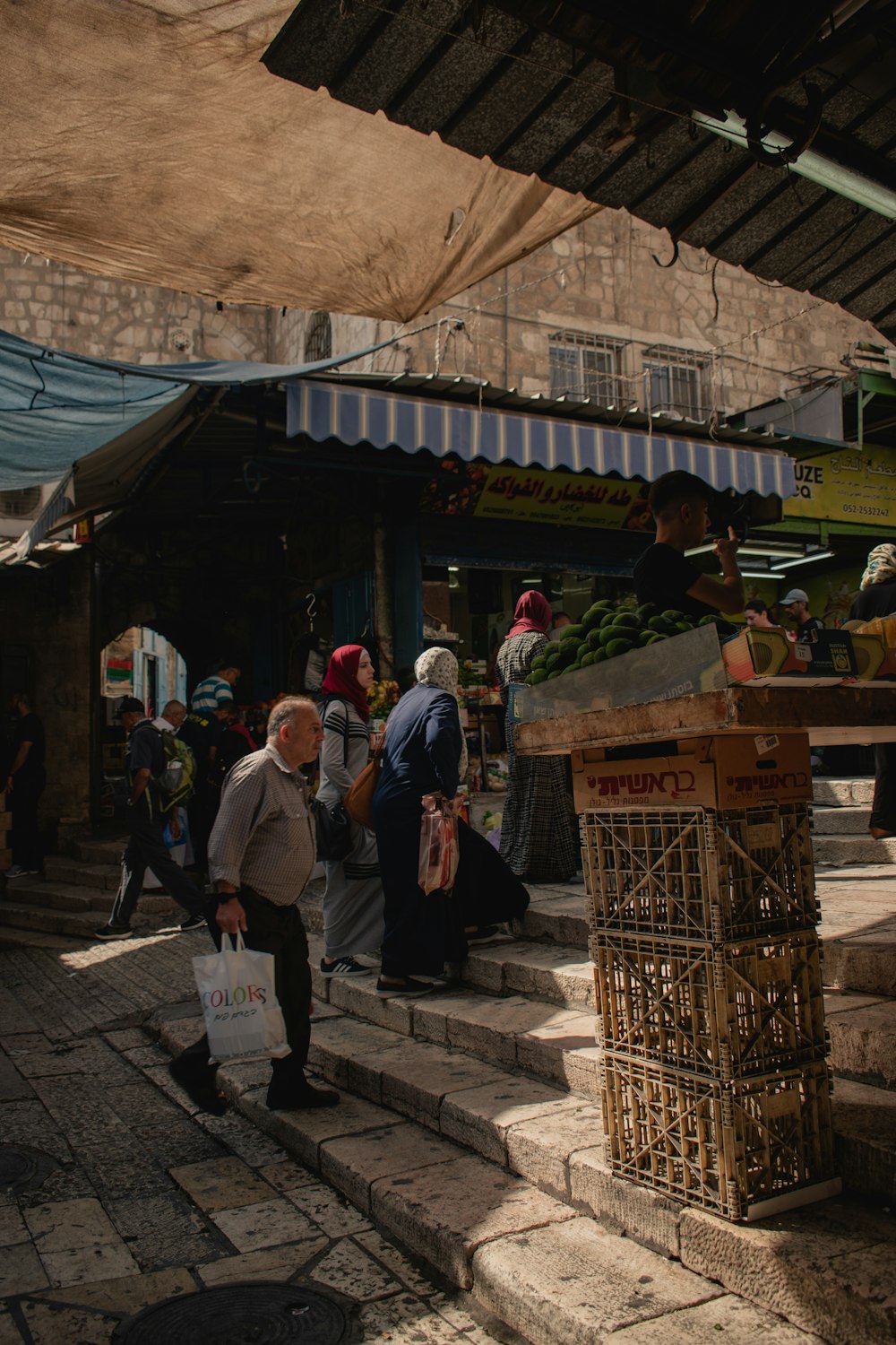 a group of people walking around a market