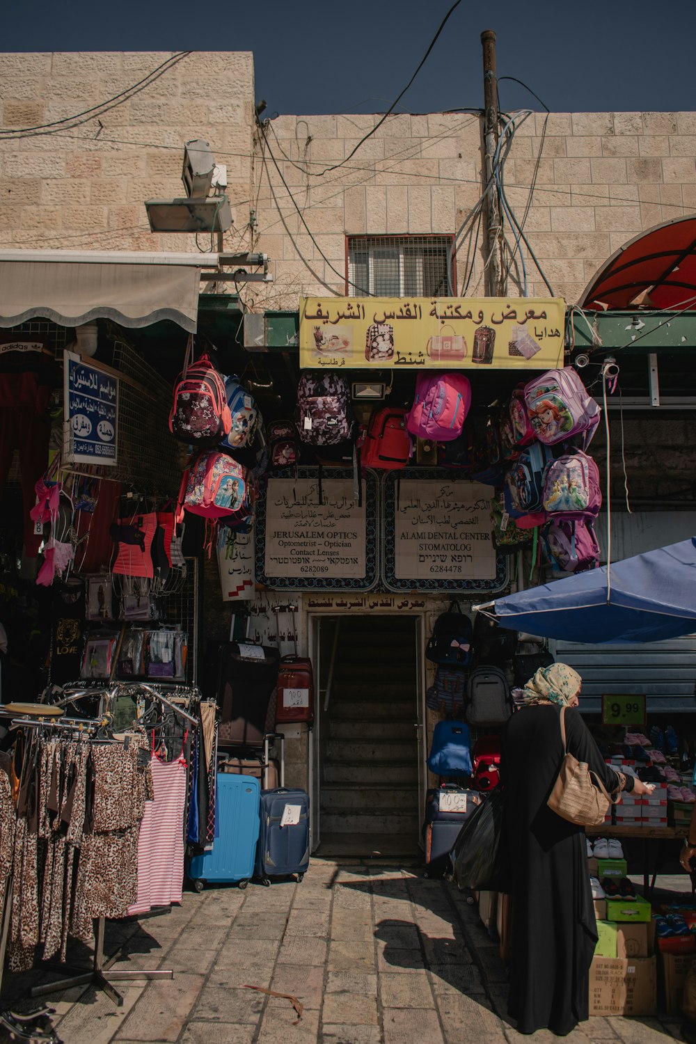 a woman standing in front of a store