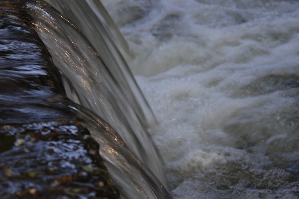 a close up of a pipe with water coming out of it