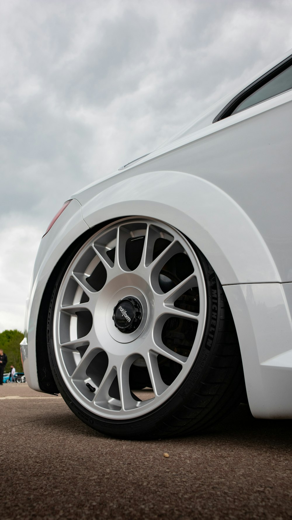 a close up of a car tire on a road