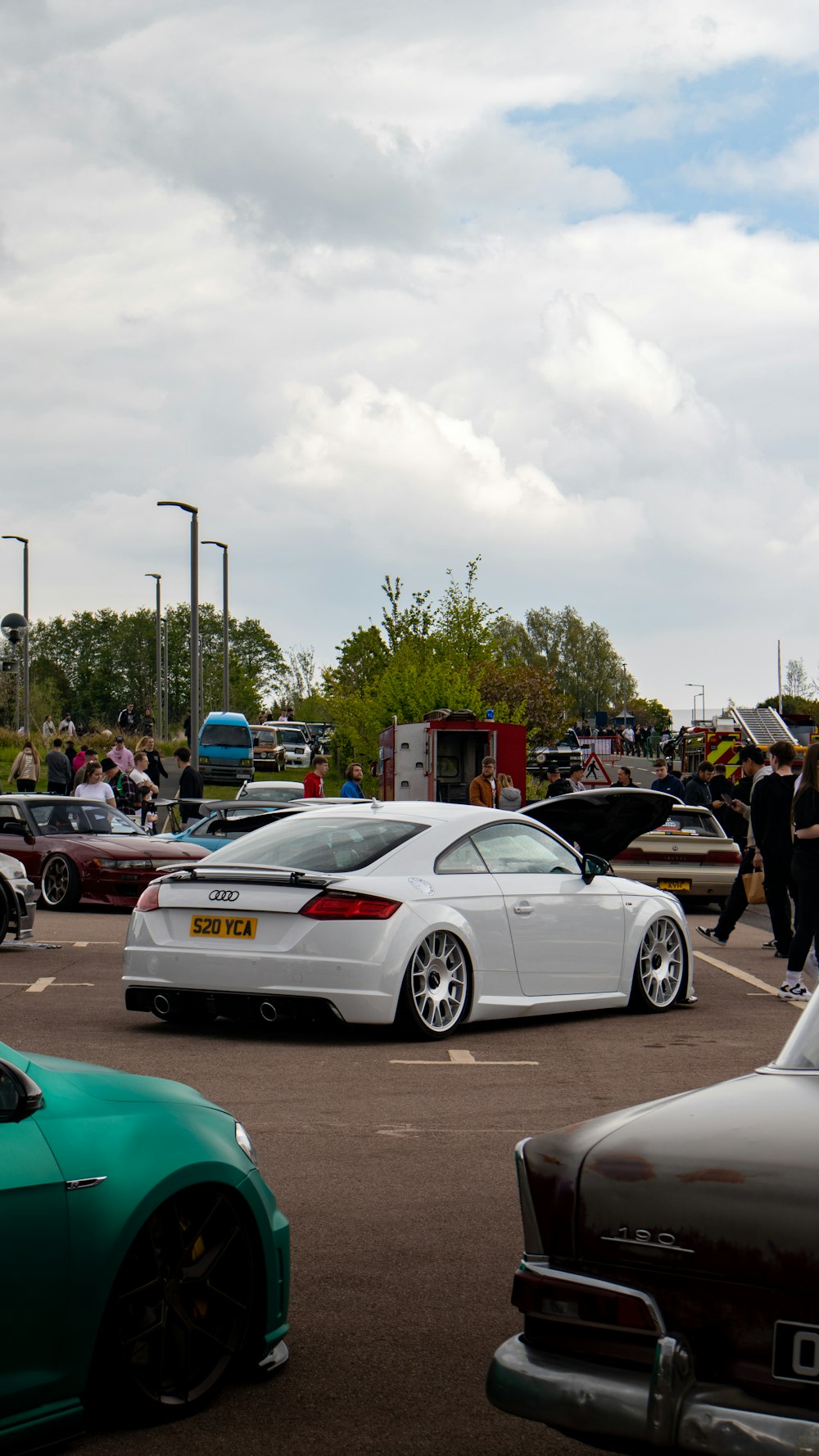 a group of cars parked in a parking lot