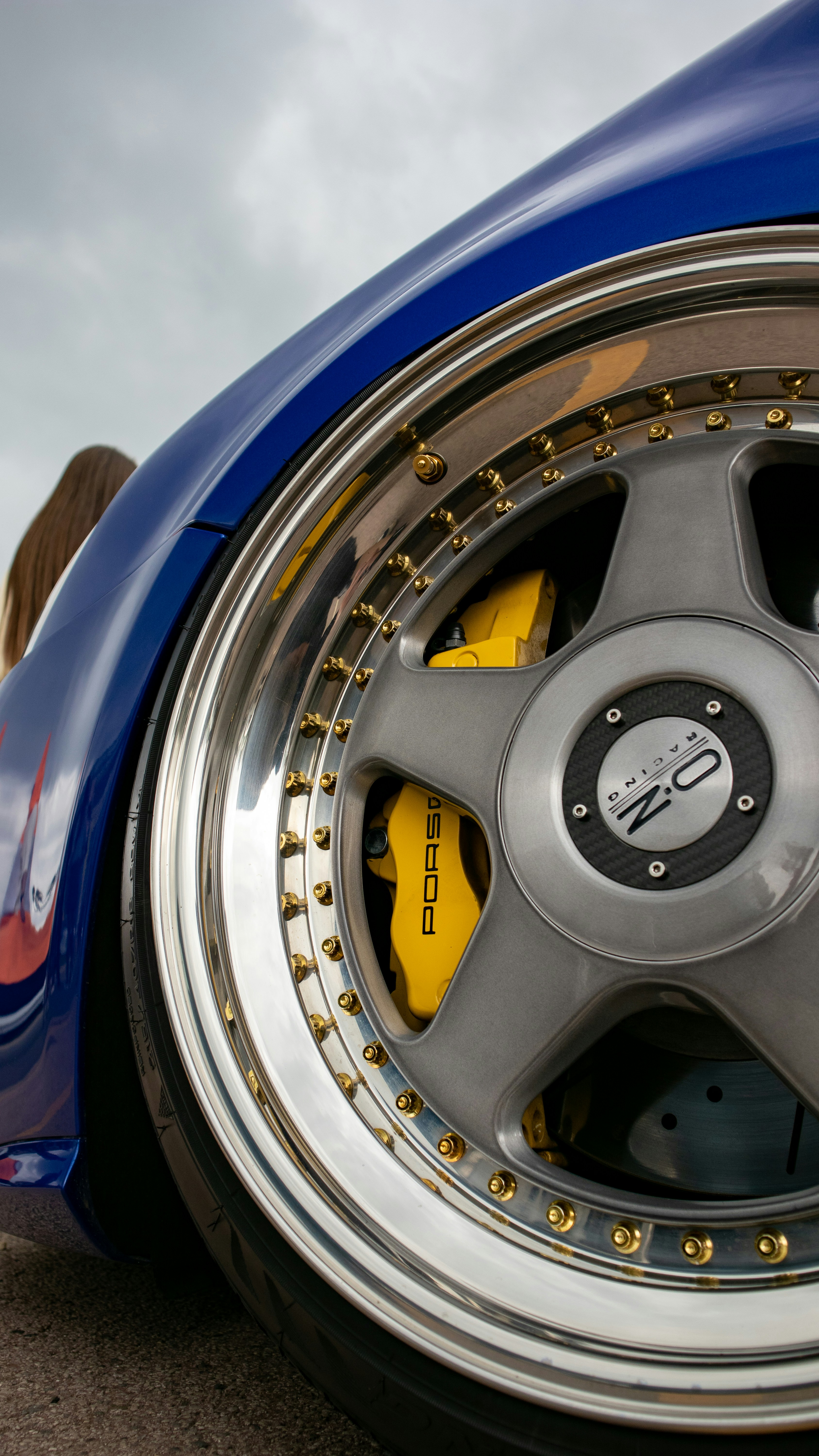 a close up of a blue sports car tire