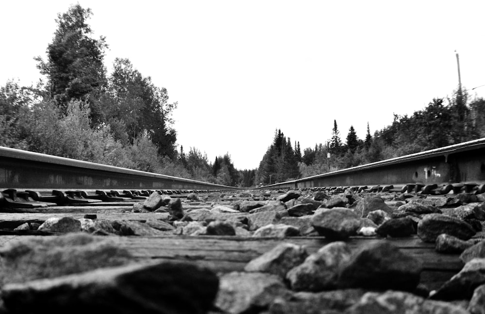 a black and white photo of a train track