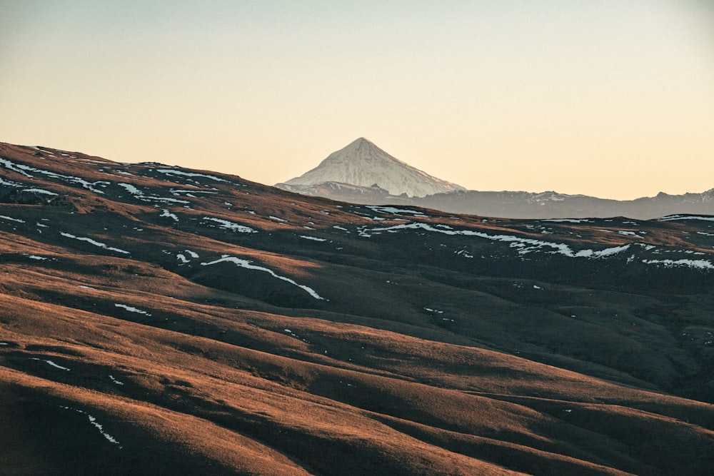 a view of a mountain with snow on it