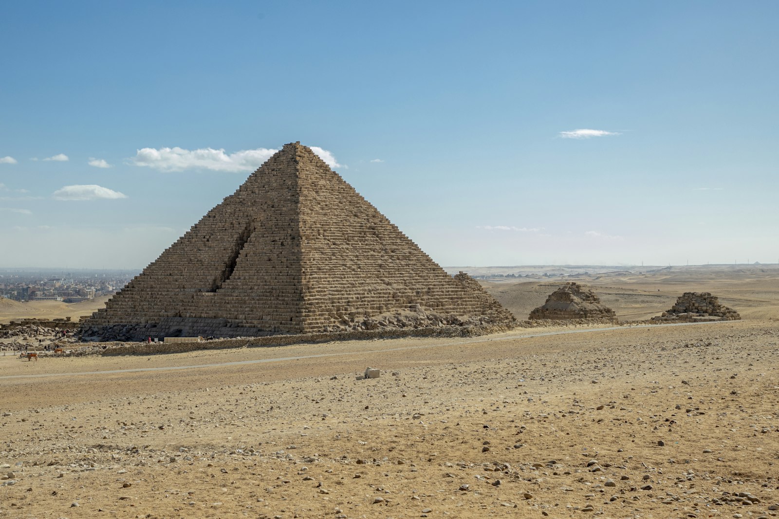 The Great Pyramids of Giza under a clear blue sky