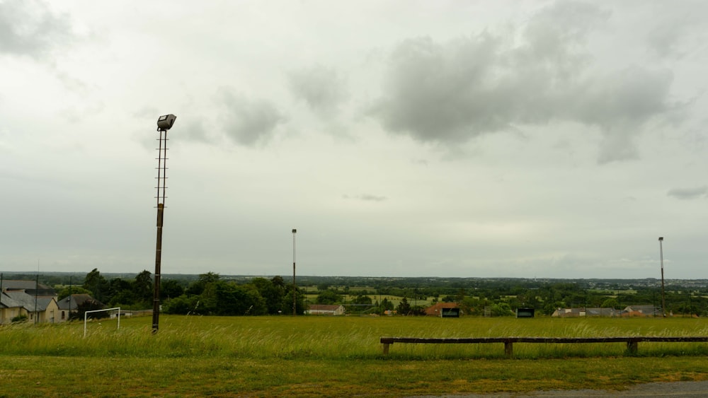 an empty field with a street light in the distance