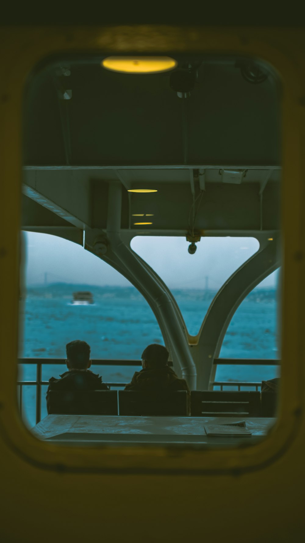 a couple of people sitting on top of a boat