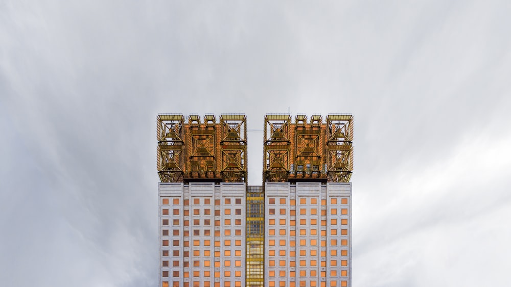 a tall building with a crane on top of it