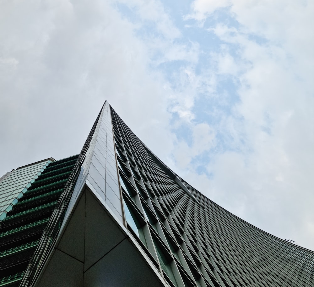 a very tall building with a sky in the background