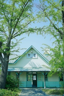 A welcoming community center entrance with greenery and clear signage.