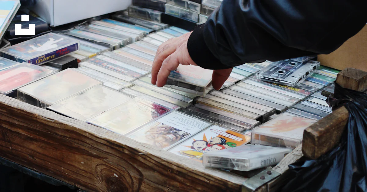 A table with a bunch of cds on it photo – Free Grey Image on Unsplash