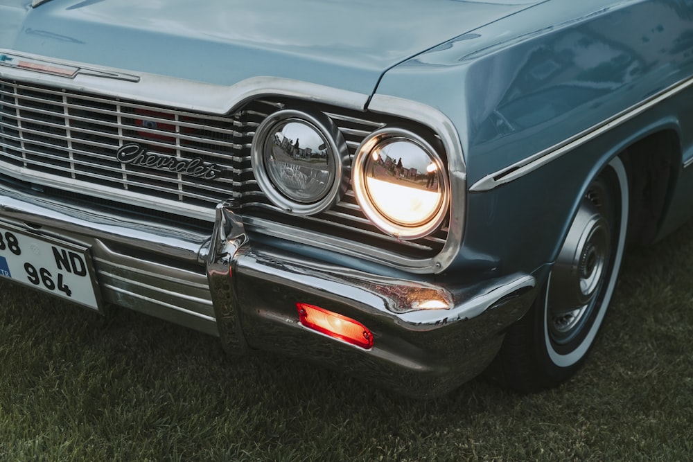 a close up of a car on a grass field