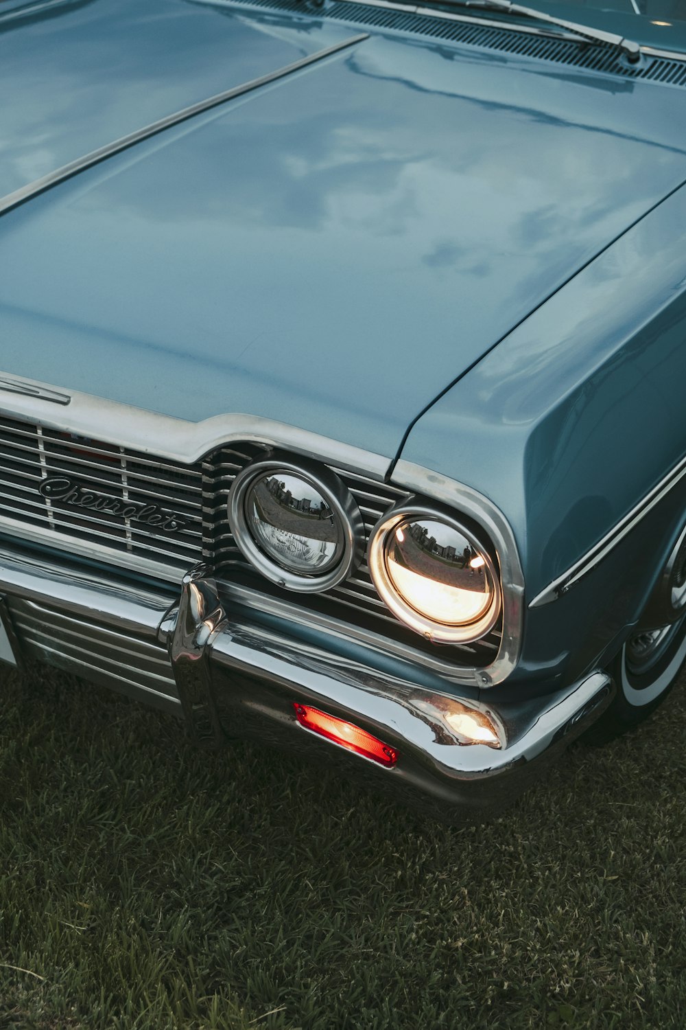 a close up of a car on a grass field