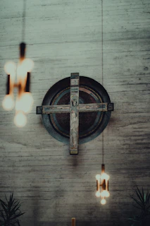 a cross hanging from the side of a wall