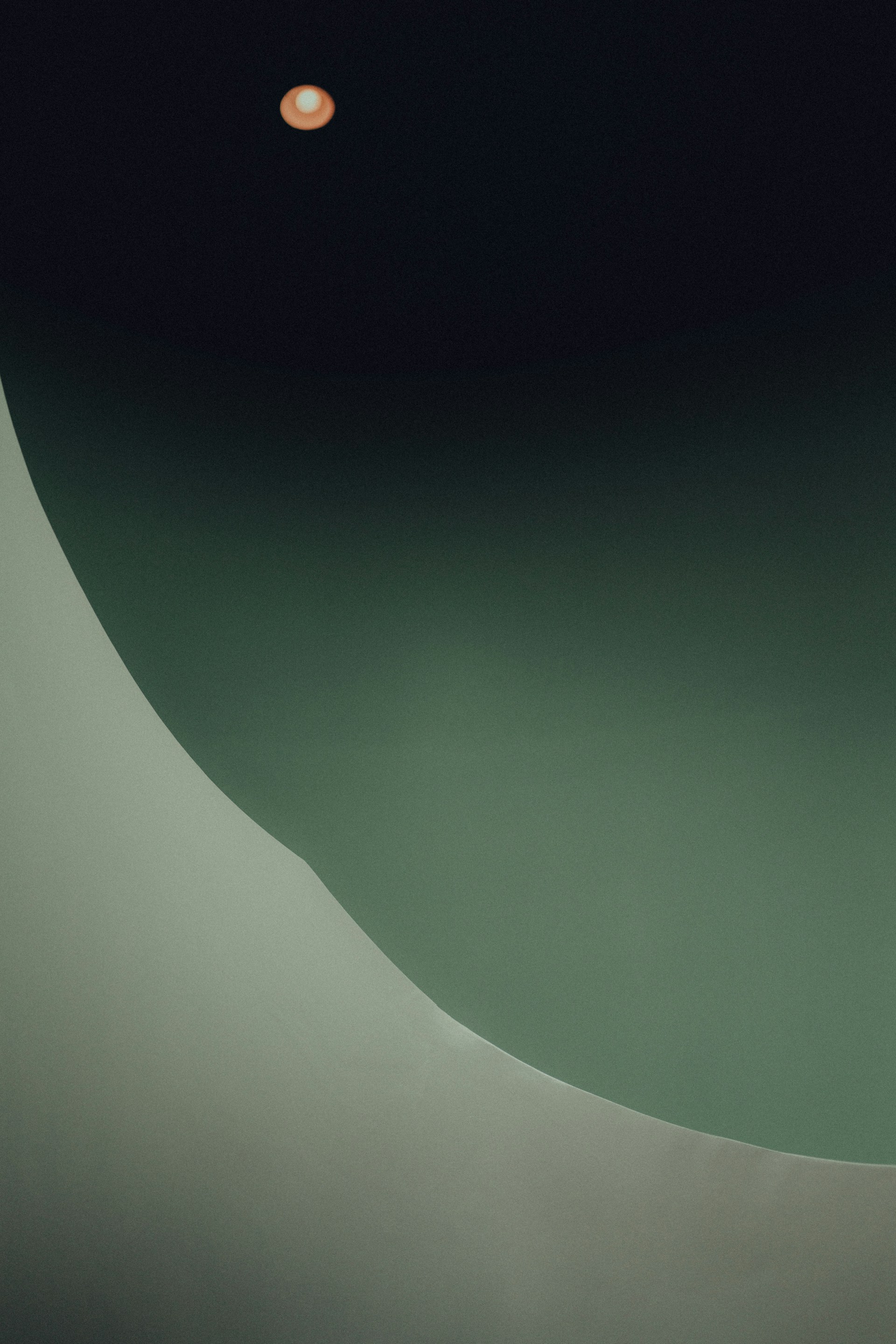 a black and white photo of a person on a surfboard