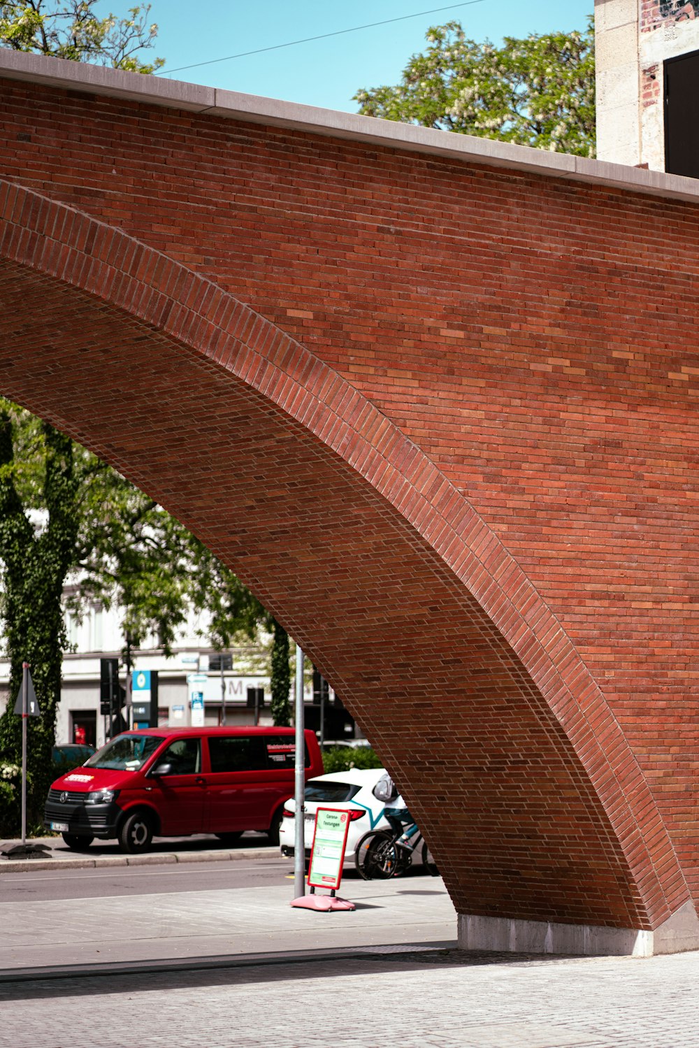 a large brick arch on a city street