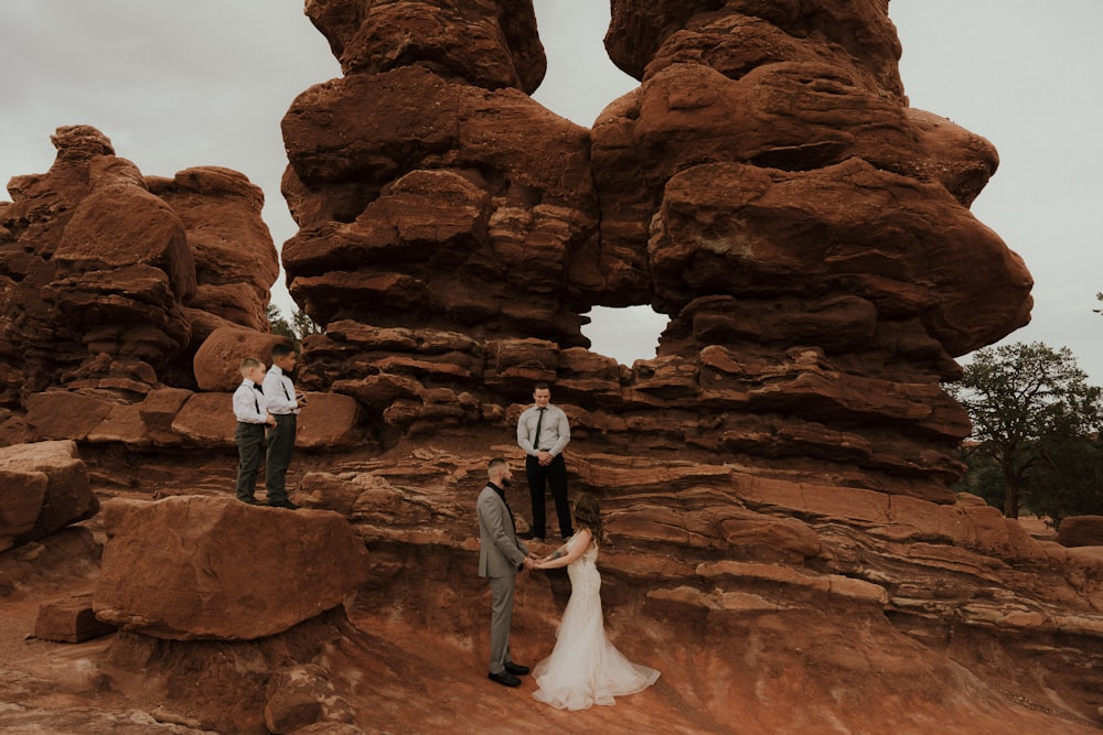 a couple of people that are standing in the dirt