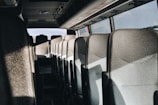 A quiet, smooth ride inside the shuttle van with soft lighting and clean seats.