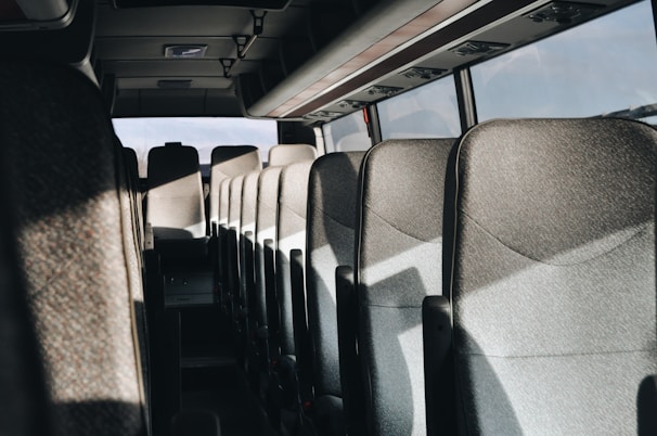 Interior shot showing the comfortable and spotless seating of a Taxi Express 27 vehicle.